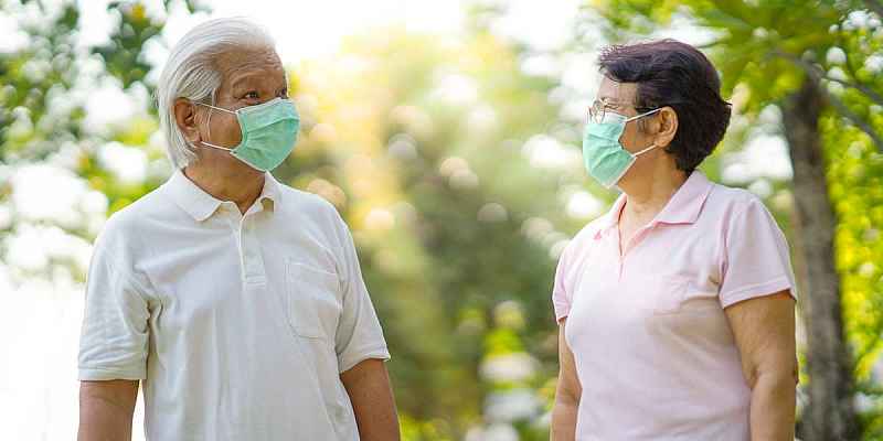 photo of two seniors wearing face masks