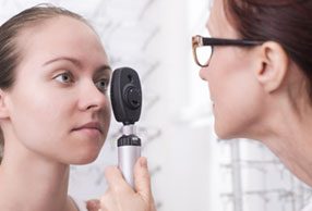 Woman having an on site eye examination