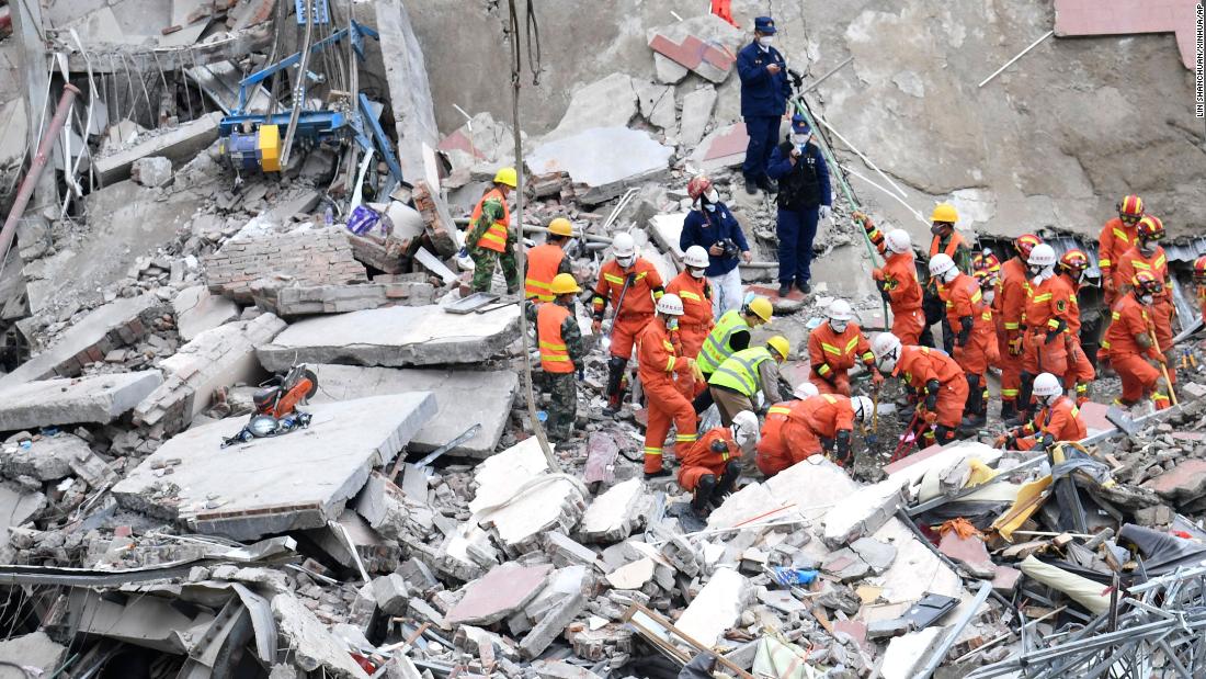 Rescuers search for victims at the site of a &lt;a href=&quot;https://www.cnn.com/2020/03/07/china/china-coronavirus-hotel-collapse/index.html&quot; target=&quot;_blank&quot;&gt;collapsed hotel&lt;/a&gt; in Quanzhou, China, on March 8. The hotel was being used as a coronavirus quarantine center.