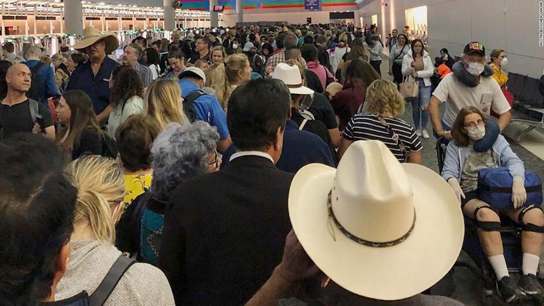 People wait in line to go through customs at Dallas/Fort Worth International Airport on March 14. Travelers returning from Europe say they were &lt;a href=&quot;https://www.cnn.com/travel/article/coronavirus-airport-screening-sunday/index.html&quot; target=&quot;_blank&quot;&gt;being made to wait for hours &lt;/a&gt;at US airports, often in close quarters, as personnel screened them for the coronavirus.