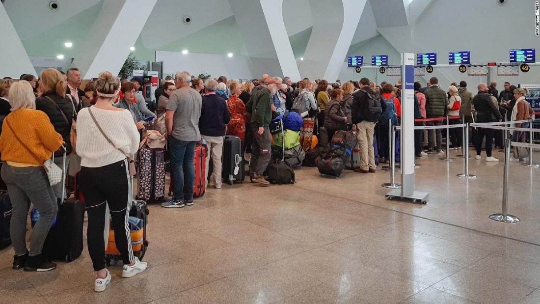 Passengers wait for their flights at Marrakesh Airport in Morocco on March 15.