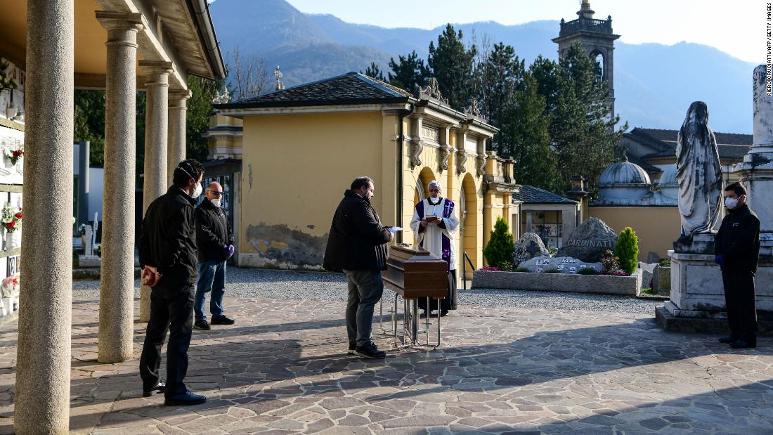 A funeral service is held without family members in Bergamo, Italy, on March 21.