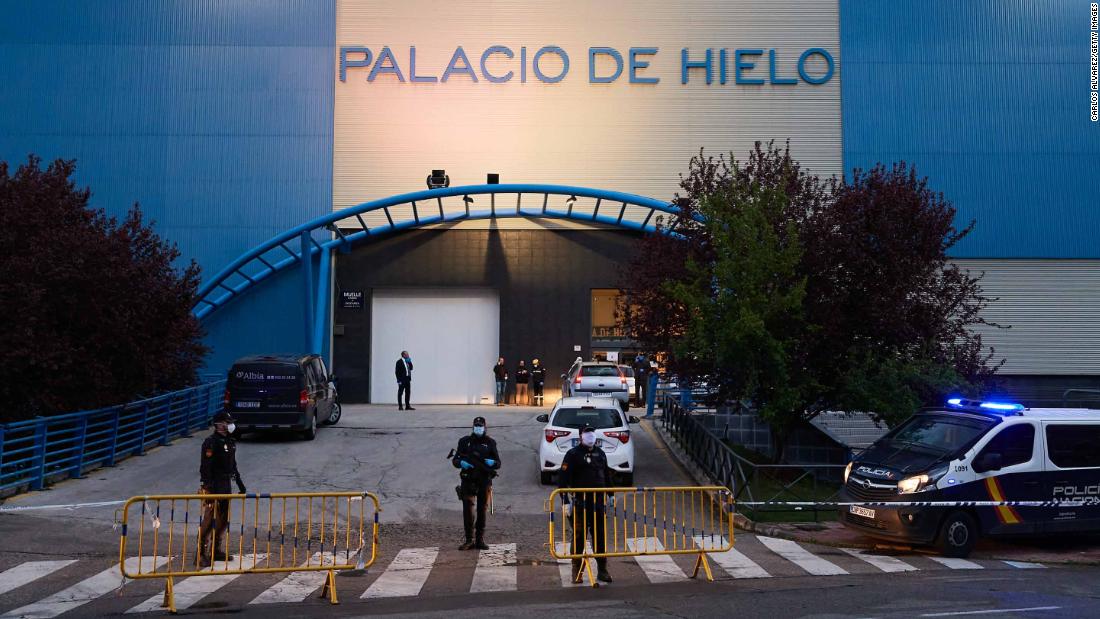 Authorities are seen in Madrid, where an &lt;a href=&quot;https://edition.cnn.com/2020/03/24/europe/spain-ice-rink-morgue-coronavirus-intl/index.html&quot; target=&quot;_blank&quot;&gt;ice rink has been converted into a makeshift morgue&lt;/a&gt; to cope with the coronavirus fallout.
