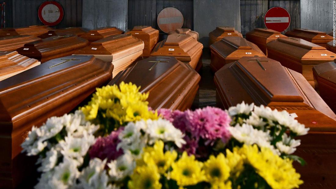 Coffins carrying coronavirus victims are stored in a warehouse in Ponte San Pietro, Italy, on March 26. They would be transported to another area for cremation.