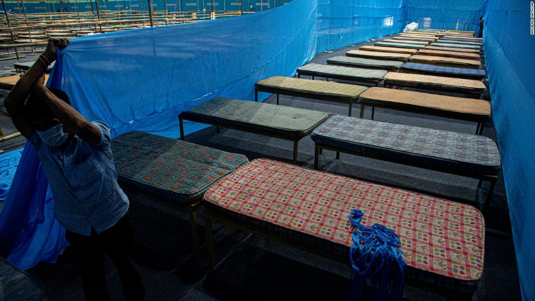 A worker fixes partitions at a quarantine center in Guwahati, India, on March 28.