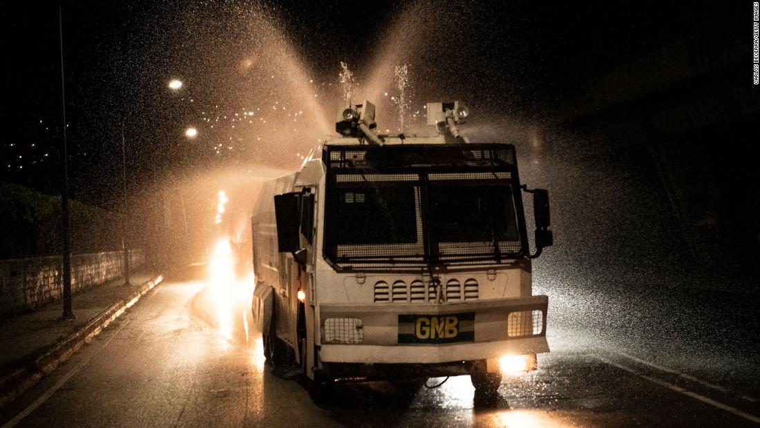A National Guard truck sprays disinfectant in Caracas, Venezuela, on March 27.