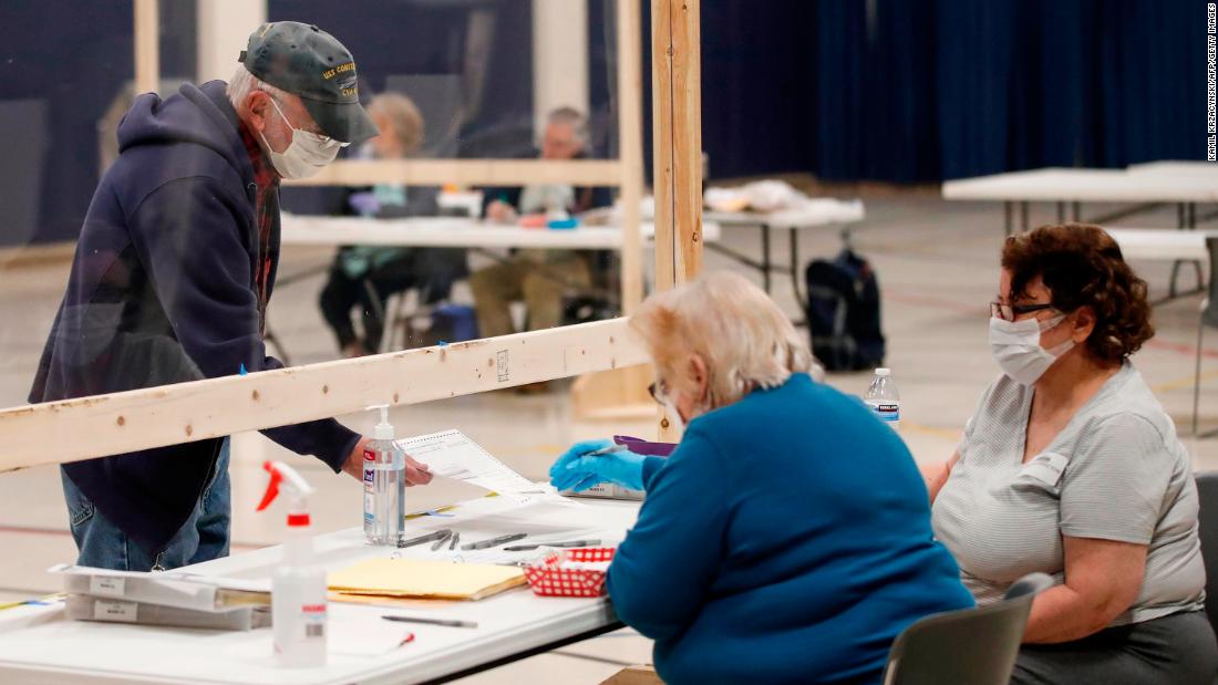A voter checks in to cast a ballot in Kenosha, Wisconsin, on April 7. The state was going through with &lt;a href=&quot;https://www.cnn.com/2020/04/07/politics/wisconsin-primary-coronavirus/index.html&quot; target=&quot;_blank&quot;&gt;its presidential primary&lt;/a&gt; despite the pandemic.