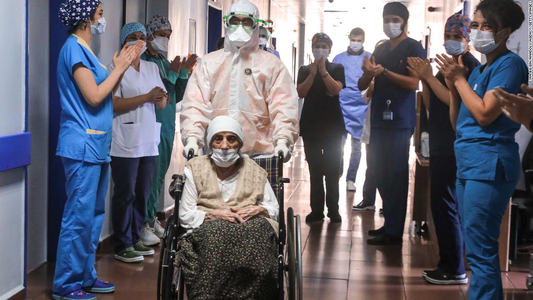 Medical workers in Istanbul clap for 107-year-old Havahan Karadeniz as she is discharged from the hospital on April 13. She had just recovered from the coronavirus.
