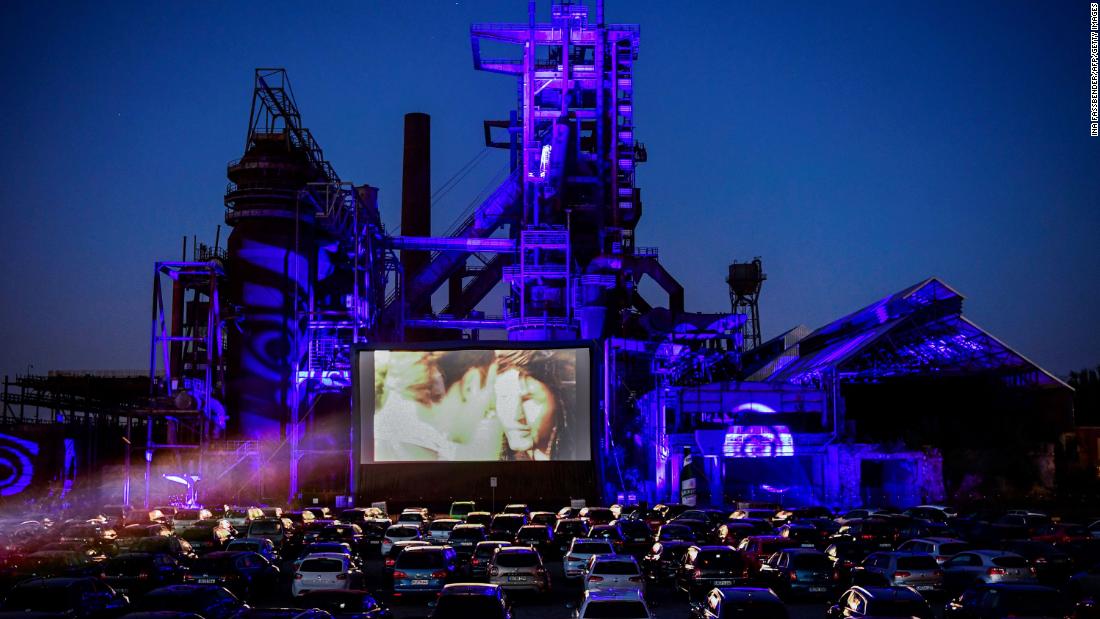 Cars sit at a newly opened drive-in cinema in Dortmund, Germany, on April 17. It&#39;s in front of a former blast furnace.