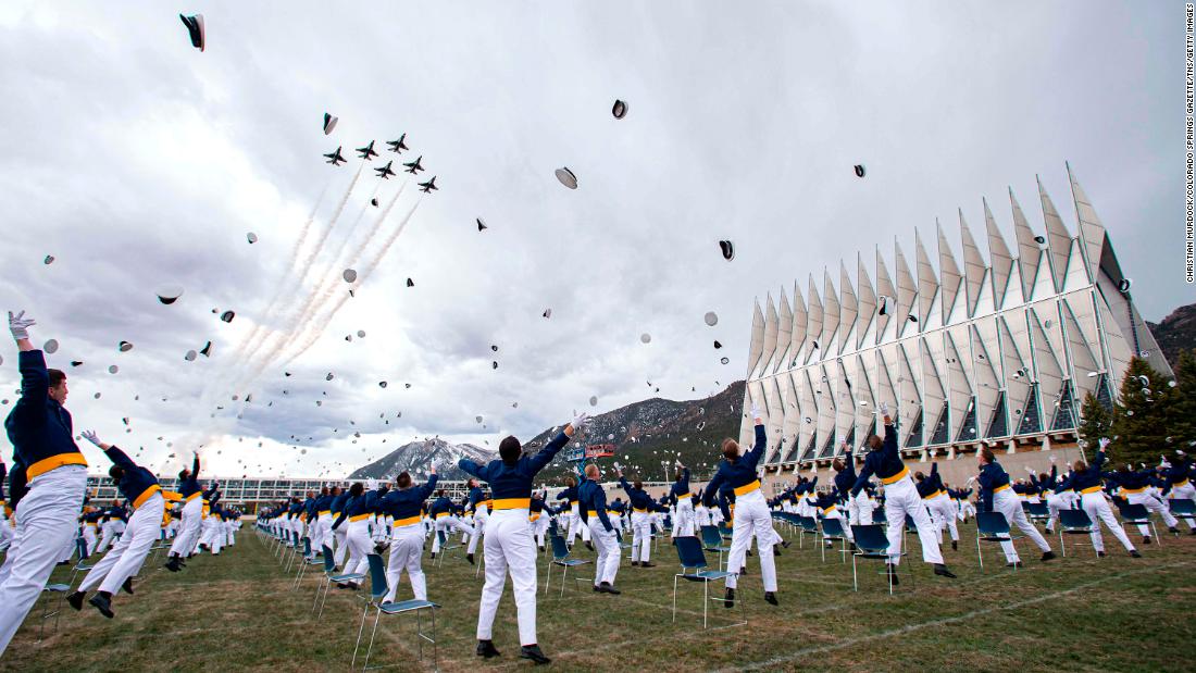 The class of 2020 tosses hats into the air at the &lt;a href=&quot;https://www.cnn.com/2020/04/18/politics/mike-pence-air-force-academy-commencement-speech/index.html&quot; target=&quot;_blank&quot;&gt;Air Force Academy graduation&lt;/a&gt; in Colorado Springs, Colorado.