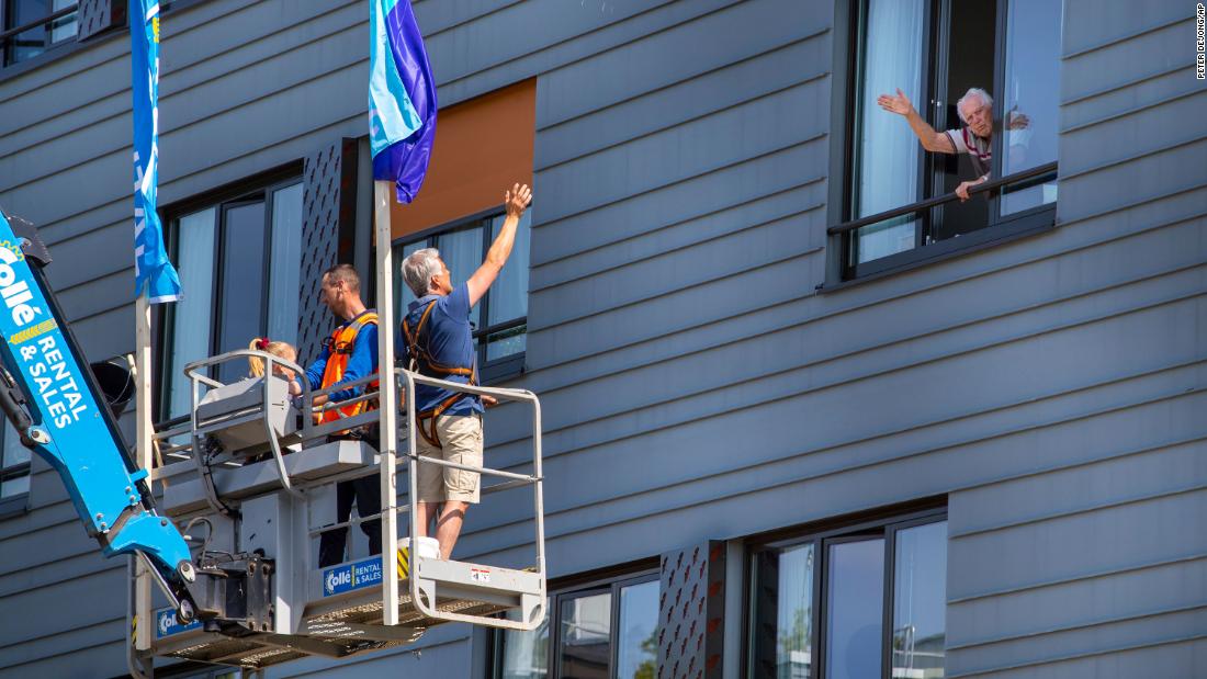 Pitrik van der Lubbe waves from a boom lift to his 88-year-old father, Henk, at his father&#39;s nursing home in Gouda, Netherlands, on April 24. Pitrik had not seen his father in more than four weeks.