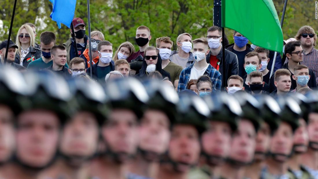 People wear face masks while watching a Victory Day military parade in Minsk, Belarus, on May 9. The parade marked the 75th anniversary of the Allied victory over Nazi Germany in World War II.