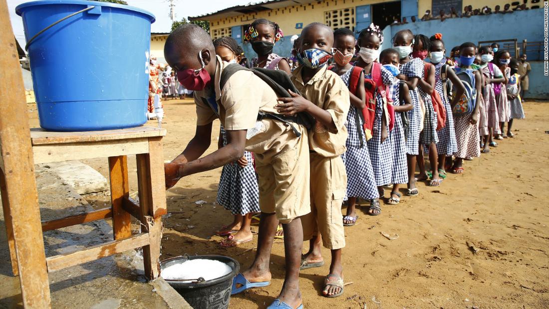 Preschool students wait to wash their hands before class in Abidjan, Ivory Coast, on May 25. The country became one of the first in West Africa to restart lessons after a two-month coronavirus shutdown. 