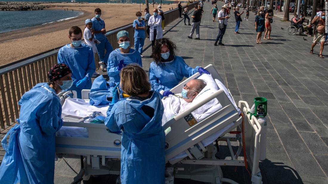 Isidre Correa, who is recovering from the coronavirus, is taken to the seaside in Barcelona, Spain, on June 3. Hospital del Mar has been taking patients to the seaside as part of the recovery process.