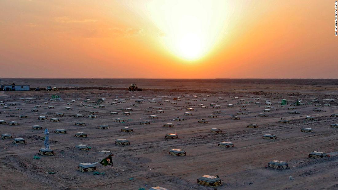 The sun sets over a cemetery for coronavirus victims near Najaf, Iraq, on June 10.