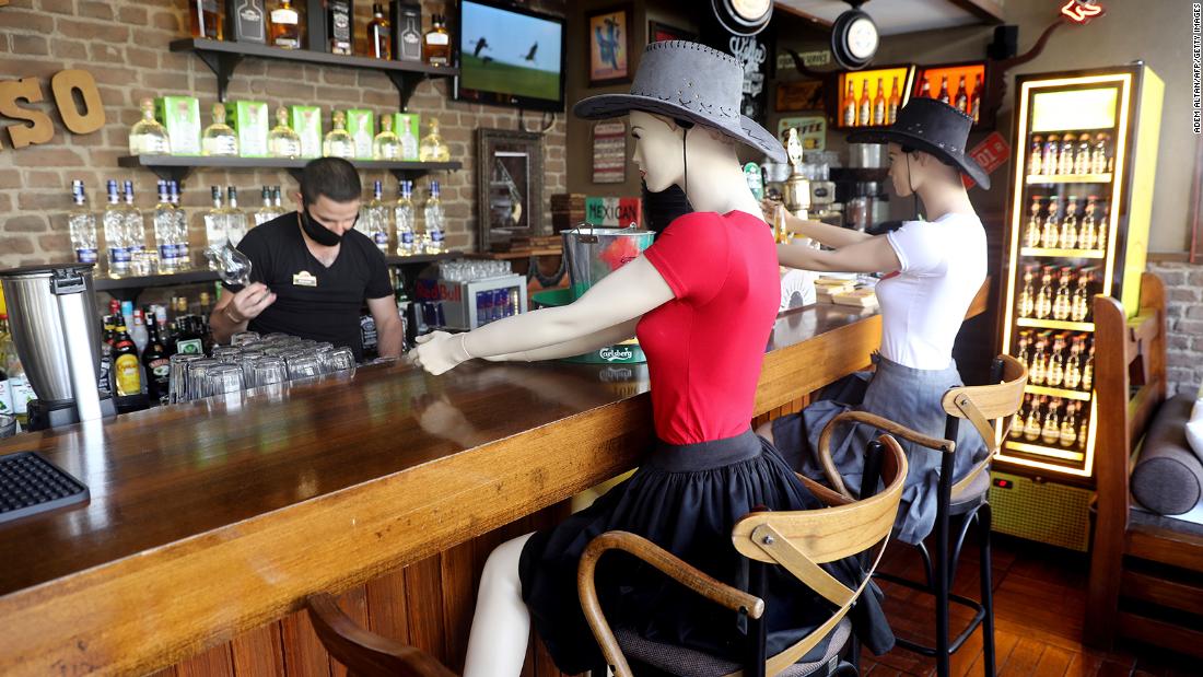 Mannequins sit at the Elpaso Bar in Ankara, Turkey, to make customers observe social distancing on June 24. The bar reopened after being closed for weeks.