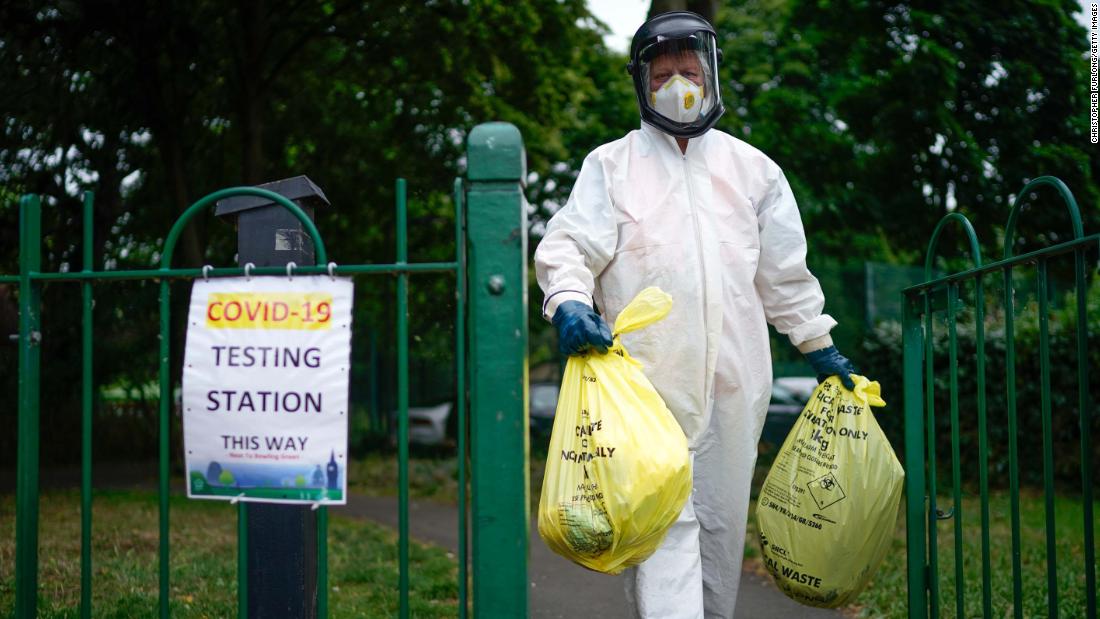 A city council worker carries trash from a coronavirus testing center in Leicester, England, on June 29. Schools and stores in the city of Leicester were closing again, with &lt;a href=&quot;https://www.cnn.com/world/live-news/coronavirus-pandemic-06-30-20-intl/h_64a41a8d1320704c23448d991d0492d2&quot; target=&quot;_blank&quot;&gt;some restrictions being reimposed&lt;/a&gt; because of its high infection rate.